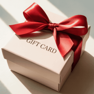 Elegant white gift card box with red satin ribbon, perfect for minimalist Christmas gifts.